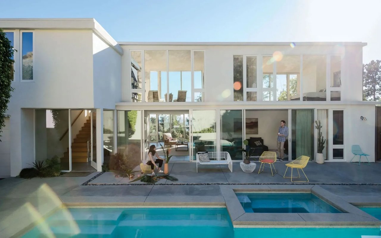 Westlake Village, CA house with a swimming pool and a man standing in front of it.