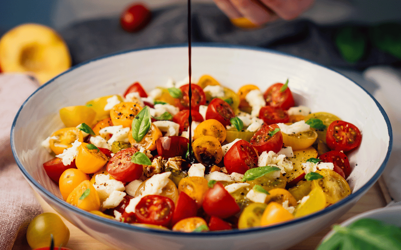 Heirloom Tomatoes with Caramelized Onions-Garlic, Mimolette, Pistou & Balsamic Drizzle