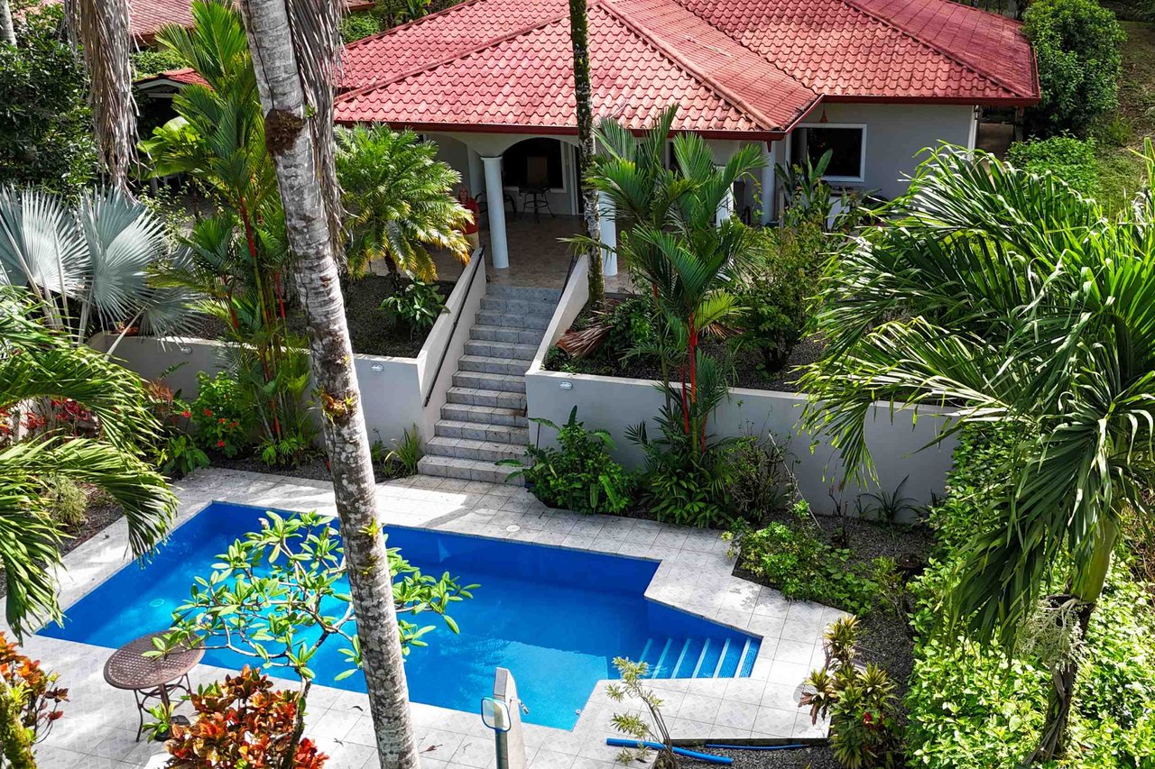 Turnkey Spacious Home with Open Layout, Pool & Small Ocean View in Ojochal Gated Community