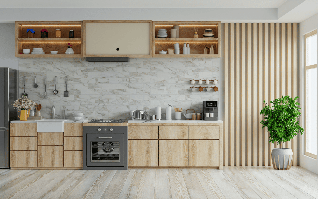  A modern kitchen features light wooden cabinetry and a light-colored, patterned tile backsplash. 
