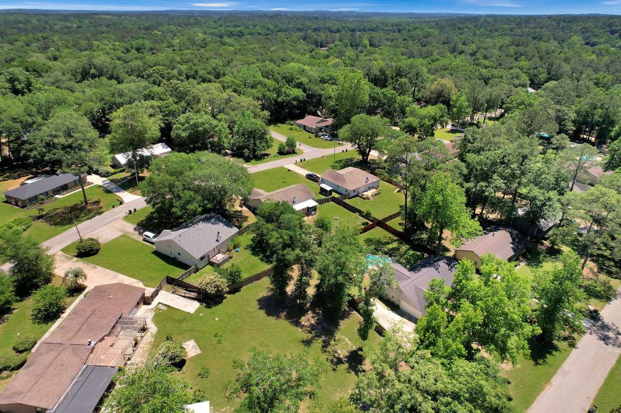 Another aerial view of Killearn Acres, highlighting a neighborhood with houses surrounded by greenery.