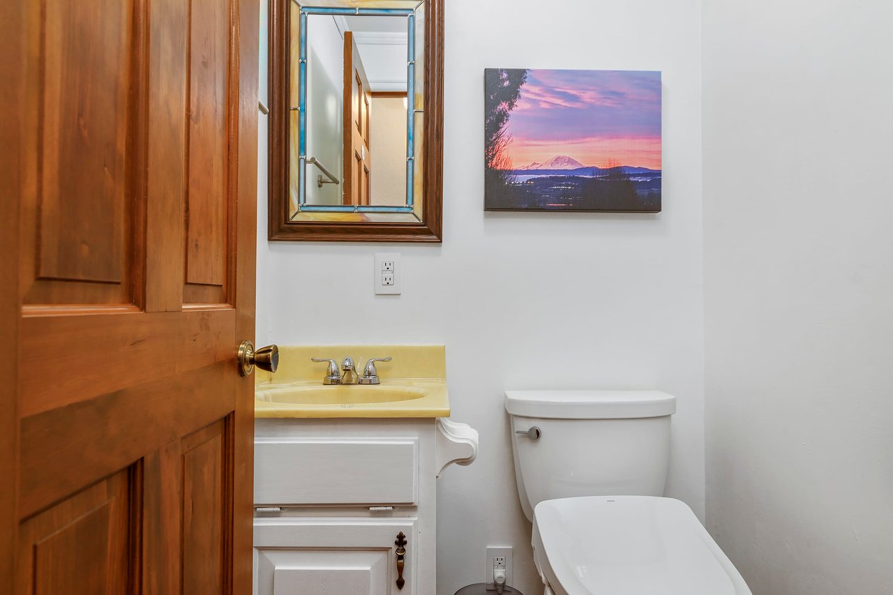 Conveniently located on the main floor, the powder room features a deba toilet seat, combining modern technology with comfort for your convenience.