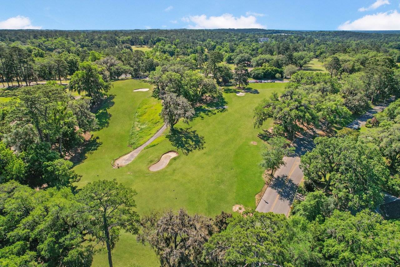 Aerial view of the Myers Park, highlighting the extensive green spaces and surrounding trees.