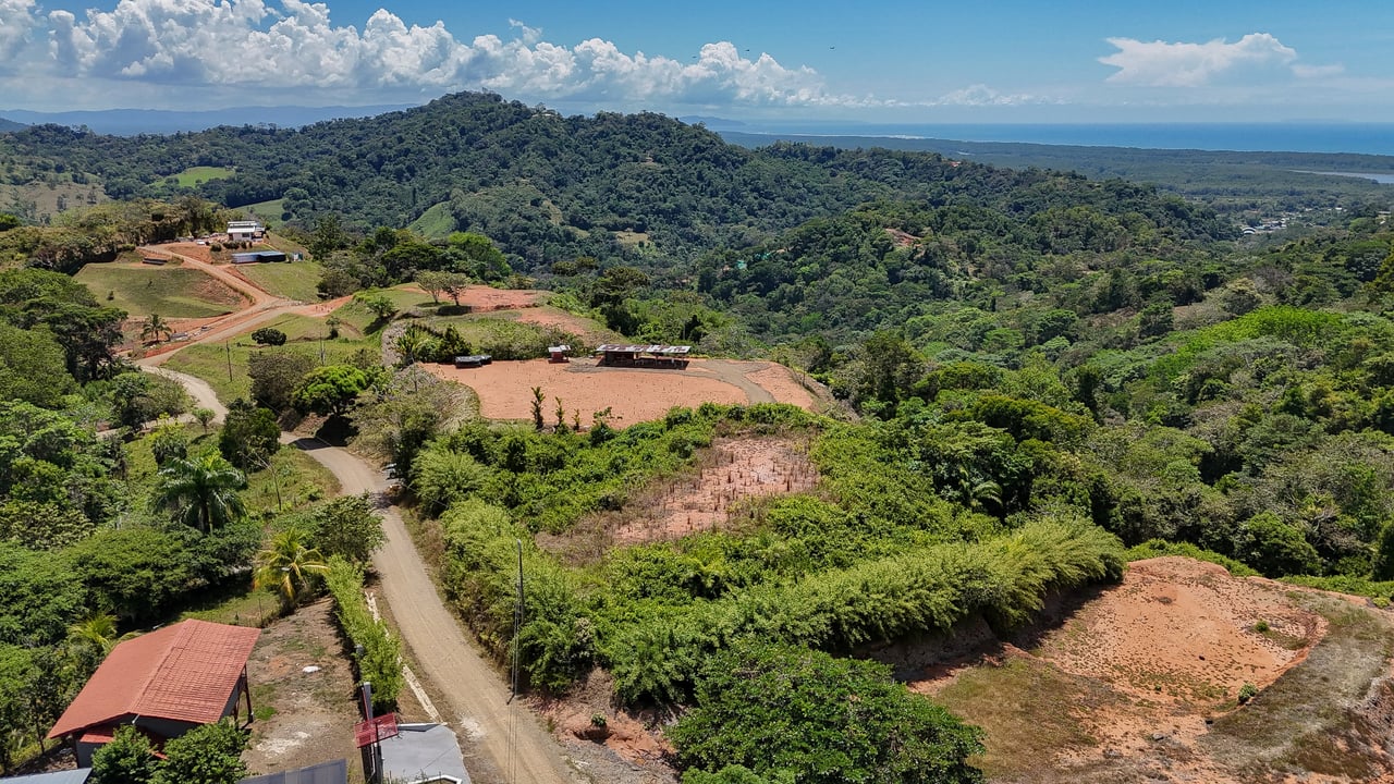 An elevated, prepared river lot with 360-degree ocean, mountain, valley and jungle views