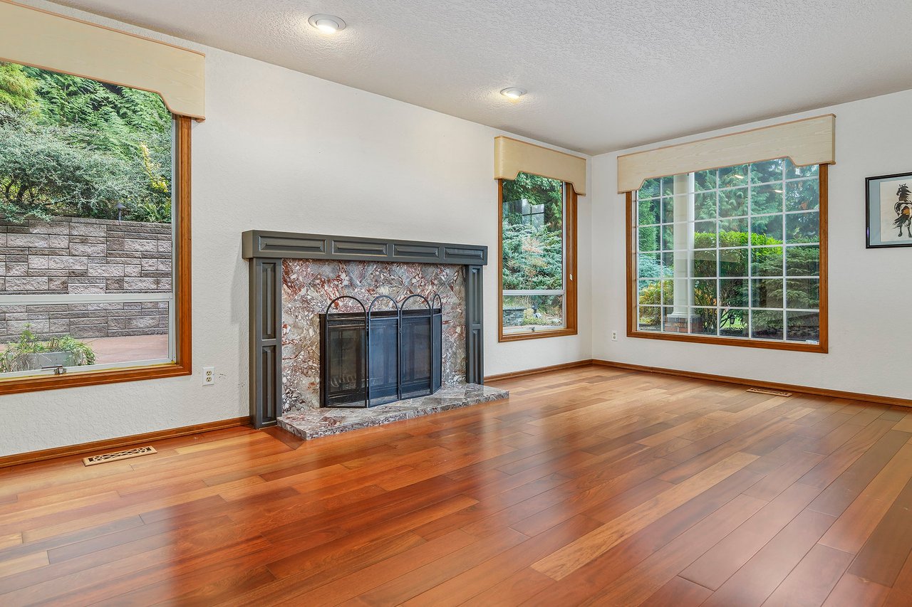 Cozy up by the fireplace in the formal living room and enjoy the ambiance of this elegant tile centerpiece.