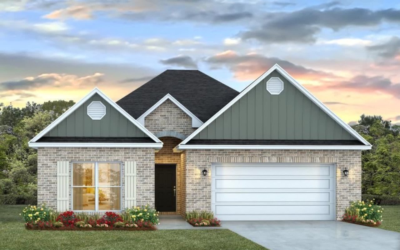 A one-story, ranch-style house with a gray roof and green siding.