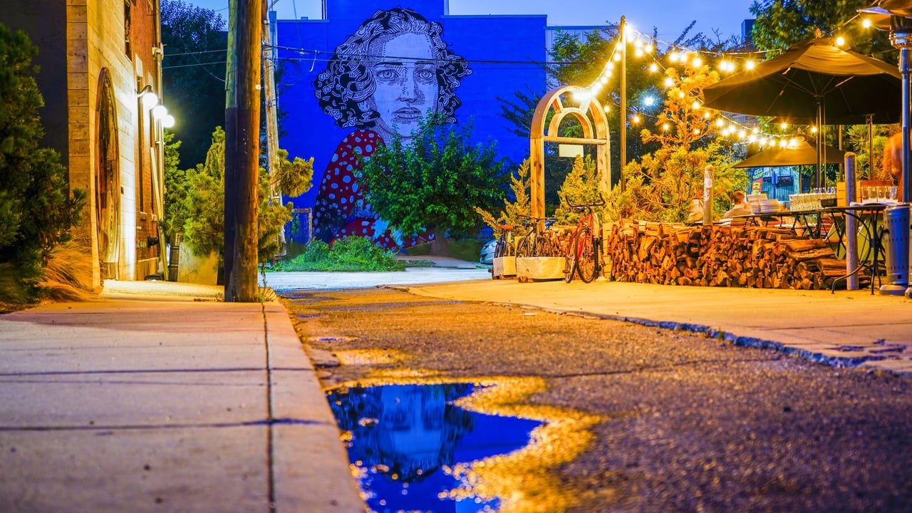 A Mural Arts Program sponsored mural titled Persistence by artist Jason Andrew Turner, overlooking the outdoor seating area of top rated Fishtown restaurant Wm. Mulherin’s Sons.