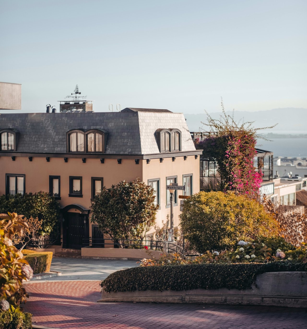 Lombard Street in San Francisco, California, known for its steep, one-block section with eight sharp hairpin turns, surrounded by beautifully landscaped gardens and classic homes.
