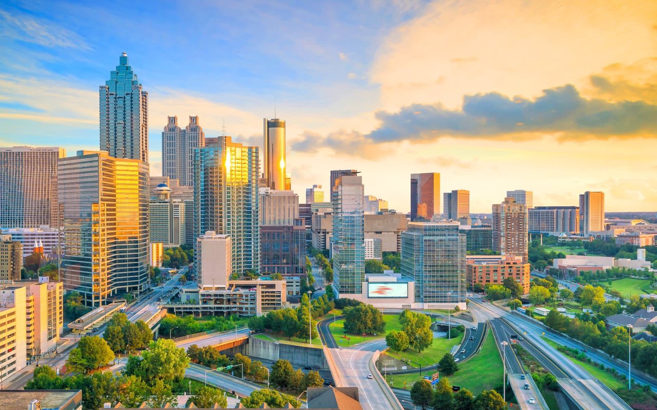 Atlanta Real Estate - Stunning cityscape with modern homes and high-rise buildings, blending urban sophistication with Southern charm in one of the most vibrant real estate markets.