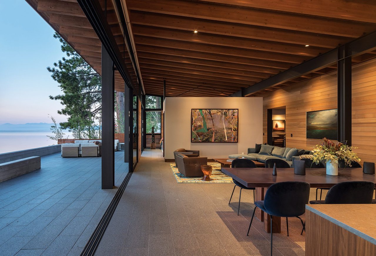The 38-foot-wide sliding glass wall with flush transition provides a seamless indoor-outdoor connection