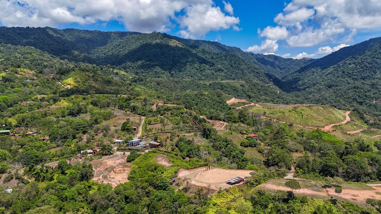 An elevated, prepared river lot with 360-degree ocean, mountain, valley and jungle views