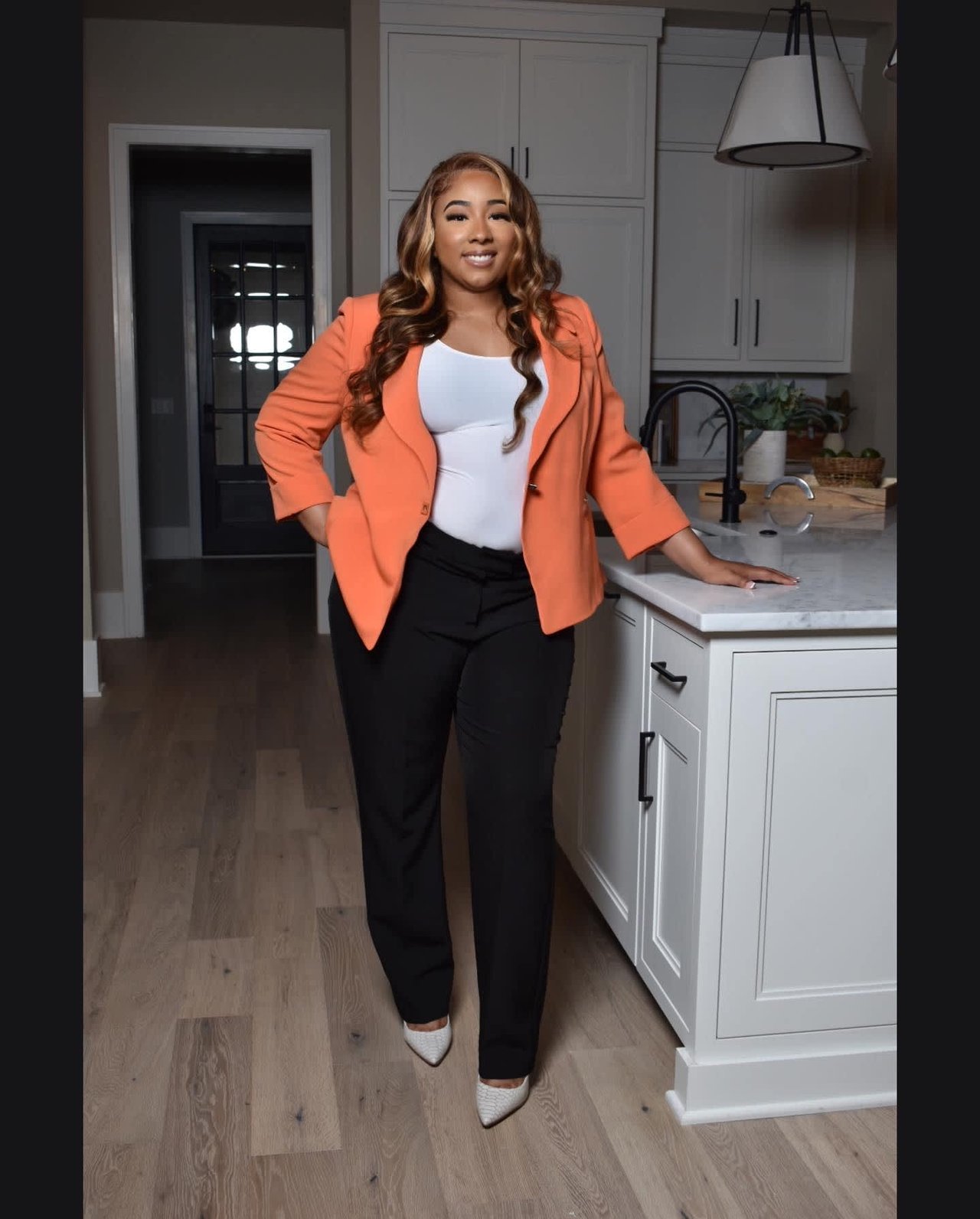 Headshot of Realtor Laticia Howard standing in kitchen