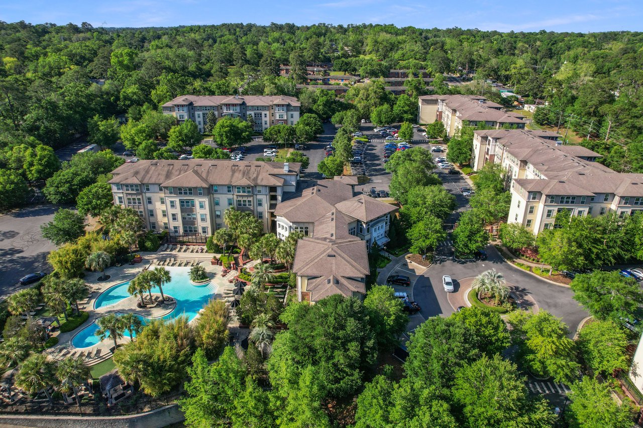 A closer aerial view of Campus Circle, showing residential buildings, a swimming pool, and landscaped areas.