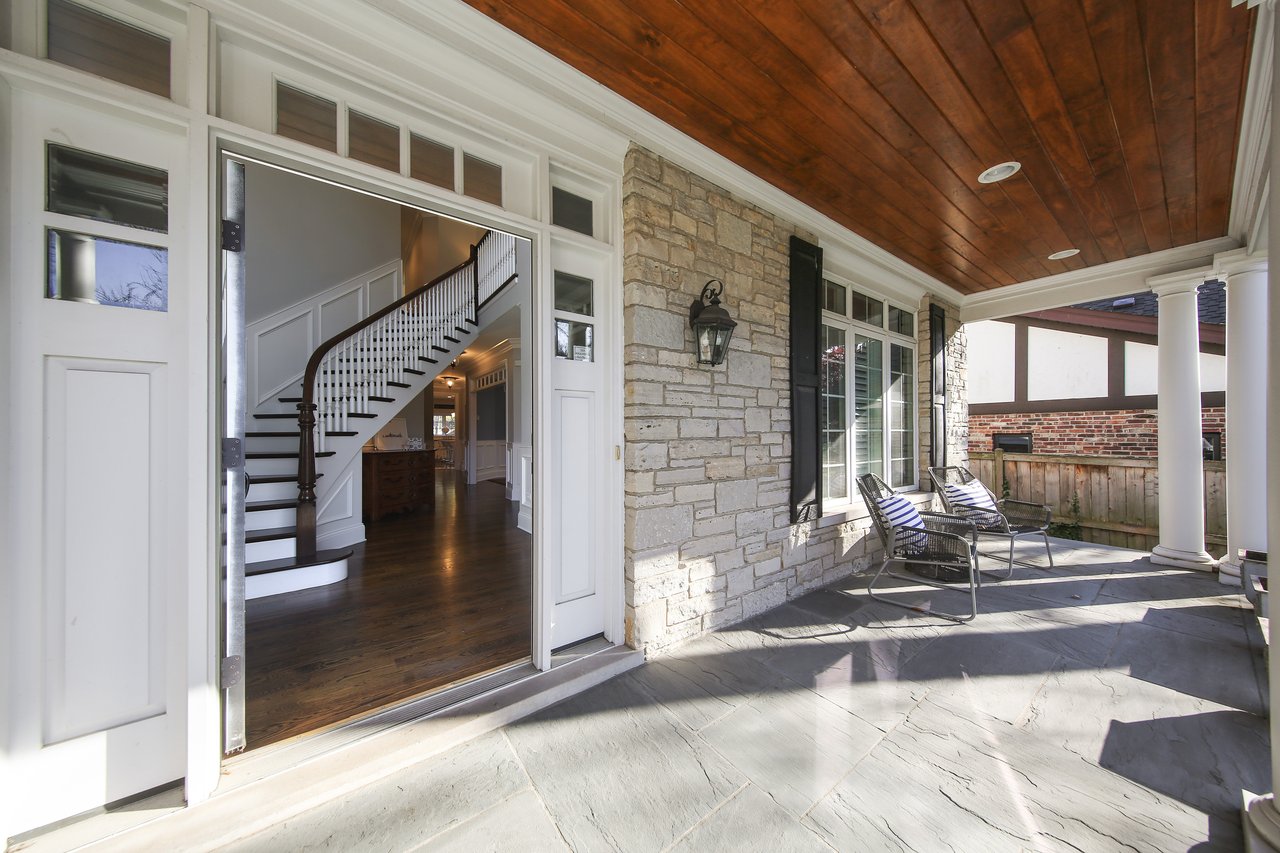 The Tree-lined Street And A Perfectly Manicured Yard Welcome You To The Entry Of The Home