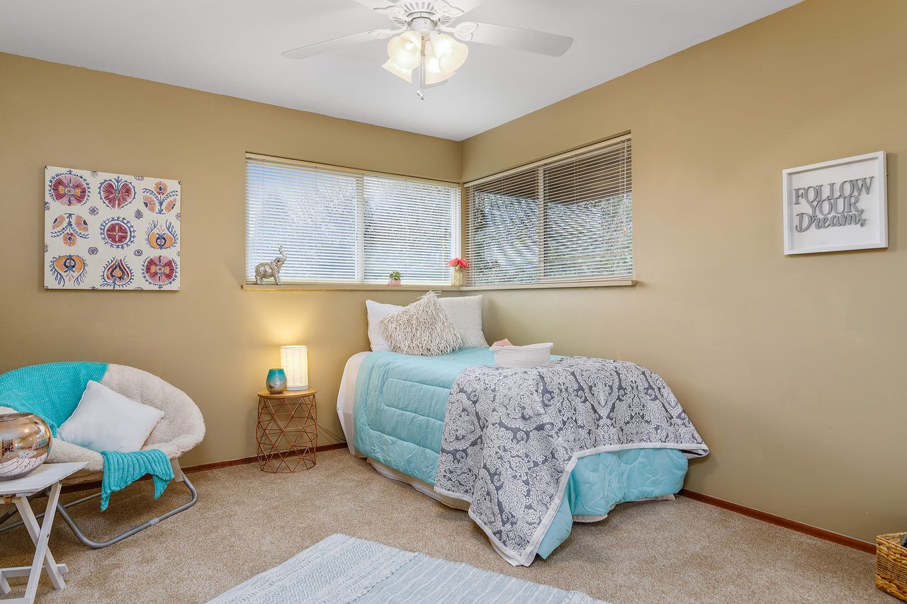 Convenience meets versatility with an additional bedroom on the main level, providing accessibility and flexibility to accommodate various living arrangements.