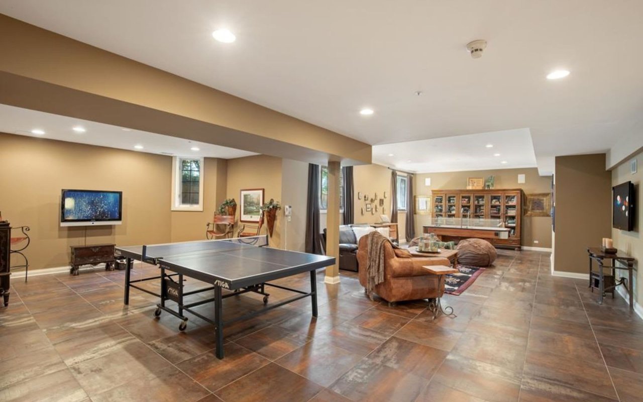 This Stately Brick Traditional Home Is Uniquely Positioned On One Of The Most Private Lots In Royal Melbourne