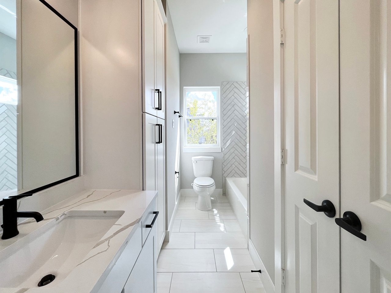 bathroom with storage cabinets 