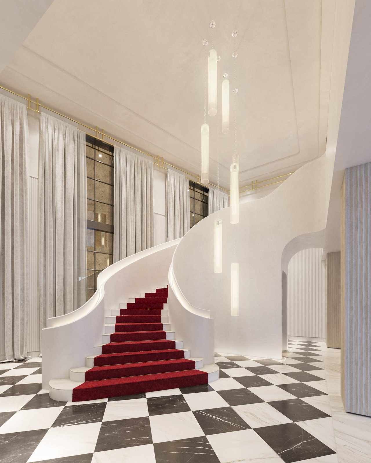 Baccarat lobby with a sweeping red-carpeted staircase and black-and-white marble floor