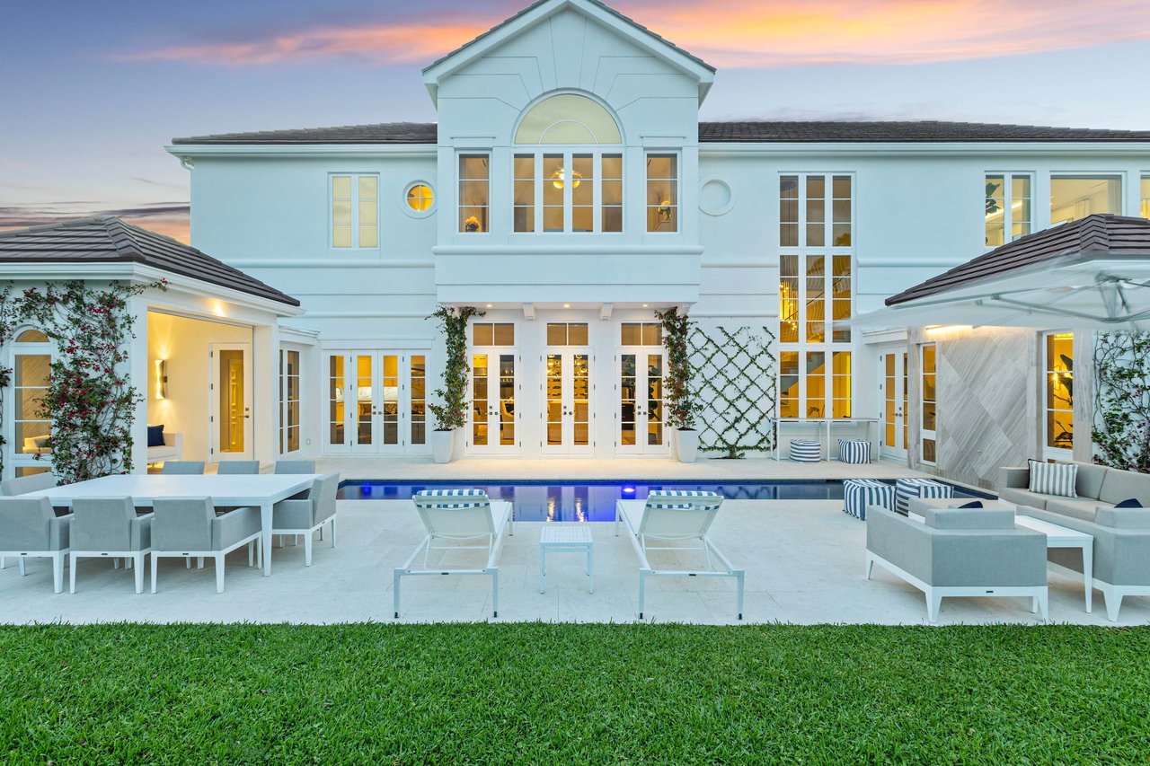 Intracoastal Waterfront Estate in SOSO featuring soaring ceilings and windows, cabanas, pool, a dock and a lift