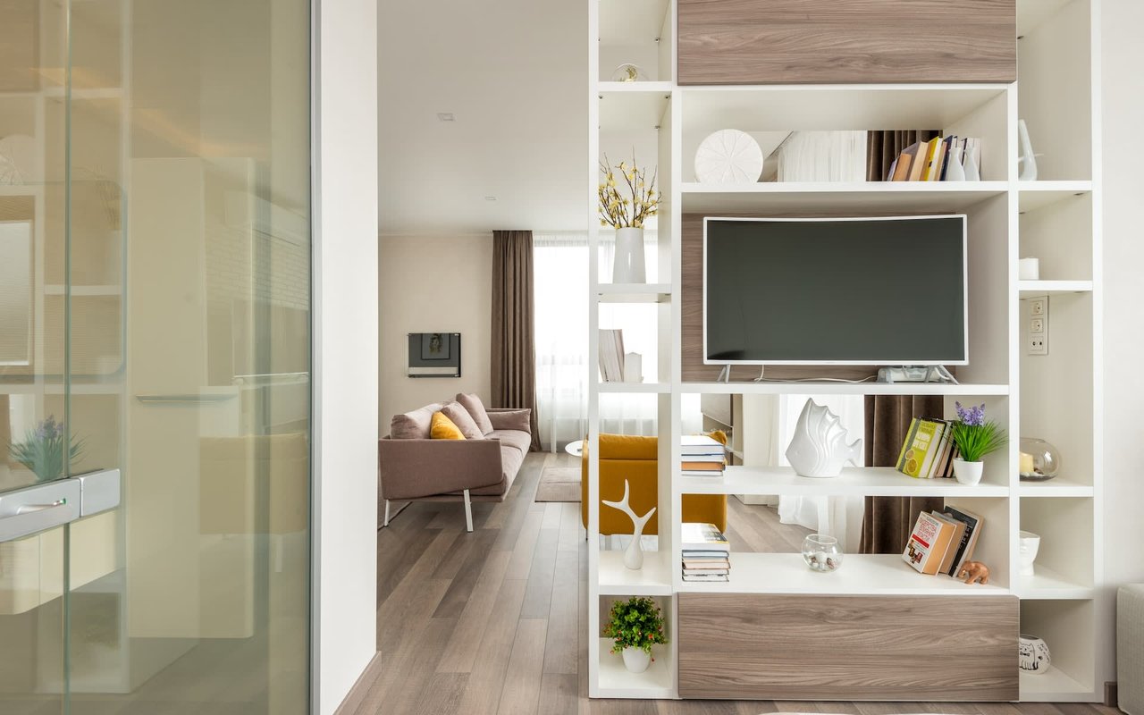 Modern Bright Living Room with Flat Screen TV and Media Console