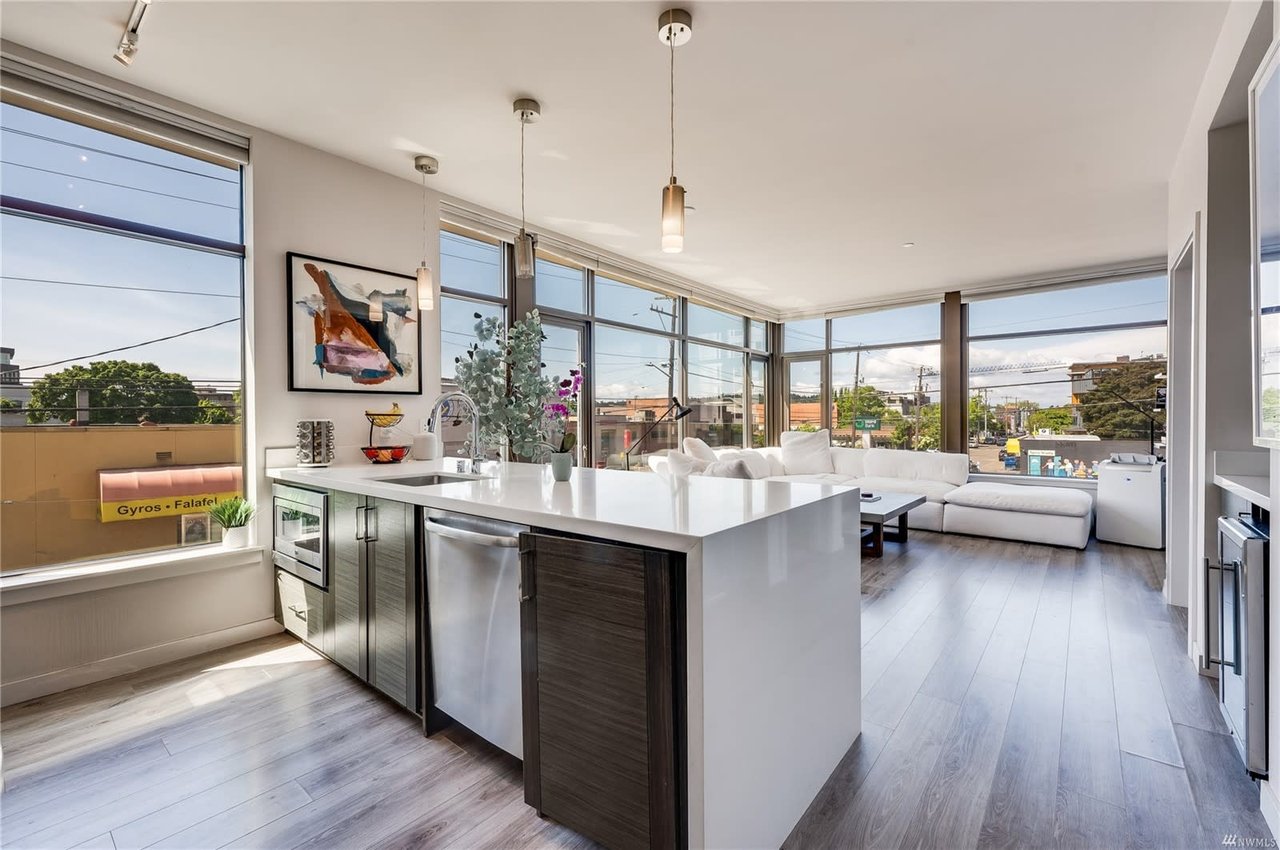 Bright and airy luxury condo living space with modern furnishings and urban views.