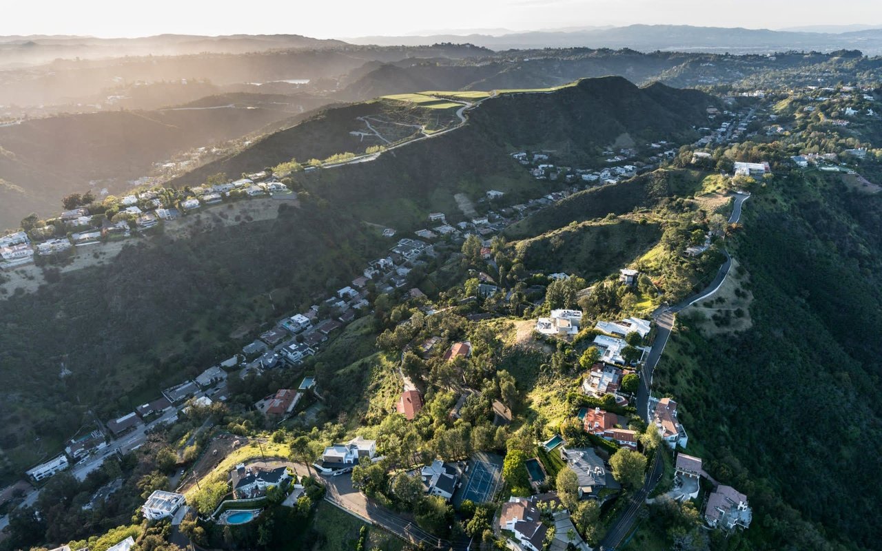 An aerial view of a residential area on top of a mountain