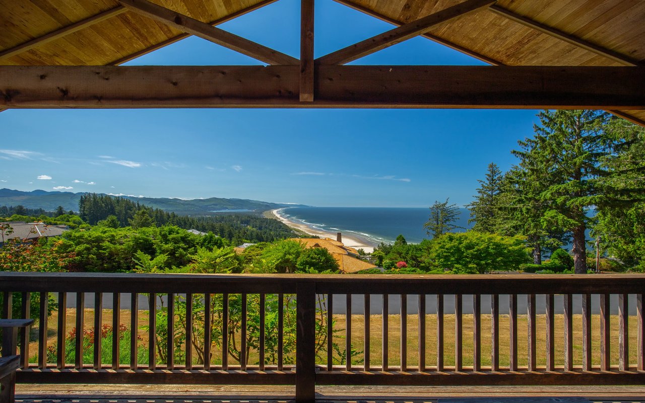 view of teh pacific on a sunny day from the deck of a neahkahnie oregon home