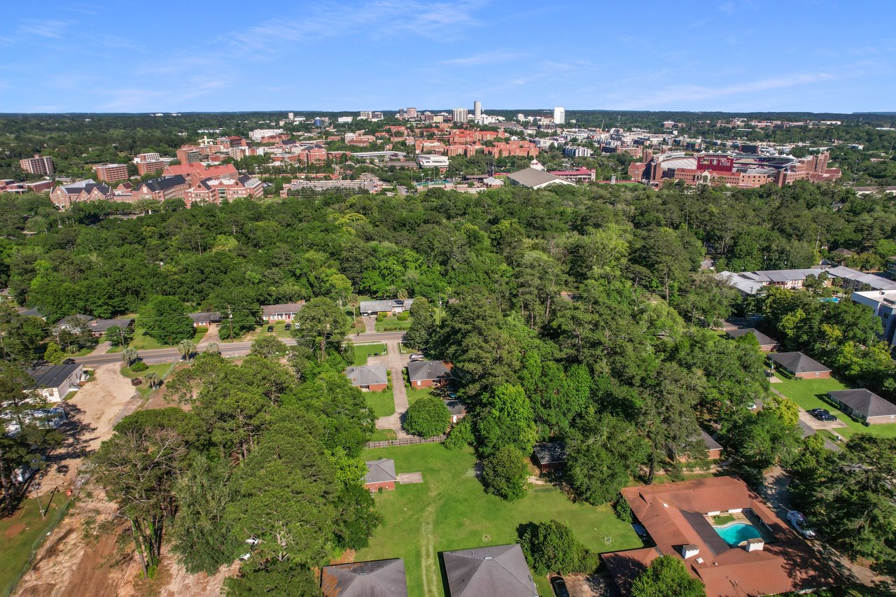 An aerial view of Chapel Hill, emphasizing the integration of residential areas with surrounding greenery and open spaces.