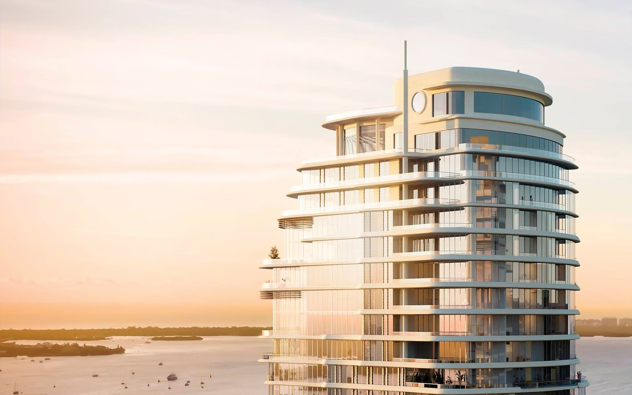 St. Regis Miami Residences tower overlooking the water at sunset.