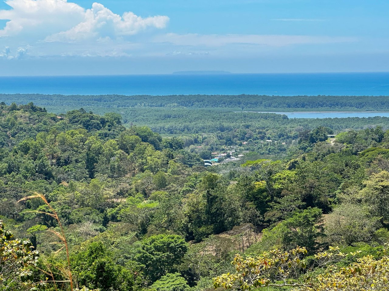 An elevated, prepared river lot with 360-degree ocean, mountain, valley and jungle views