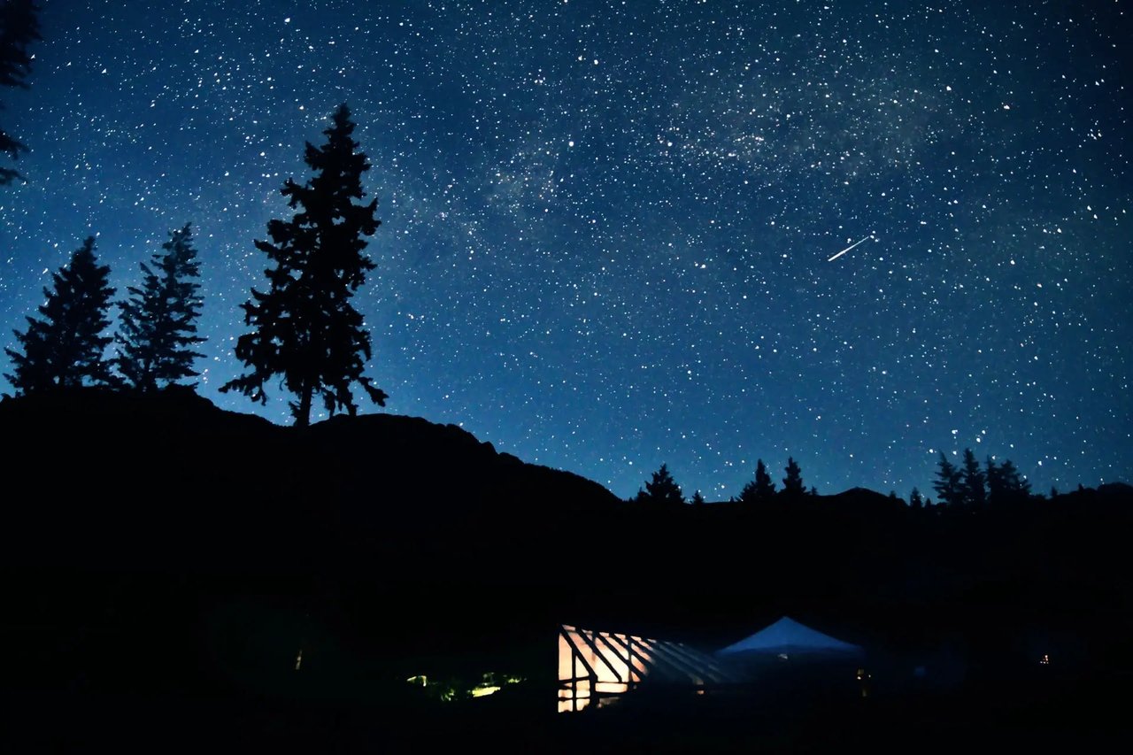 AT HOME, UNDERNEATH THE STARS