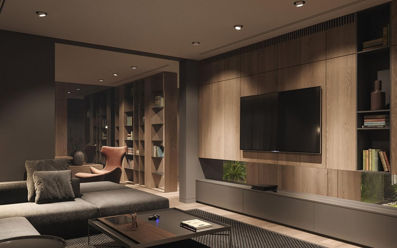 Modern living room with wooden paneling, a wall-mounted TV, and a cozy reading nook.