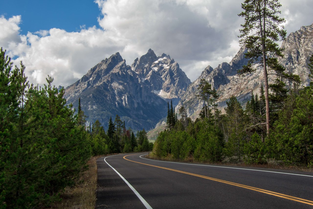 Photo taken from inner park road in Grand Teton National Park in summertime with view of the grand Teton. 