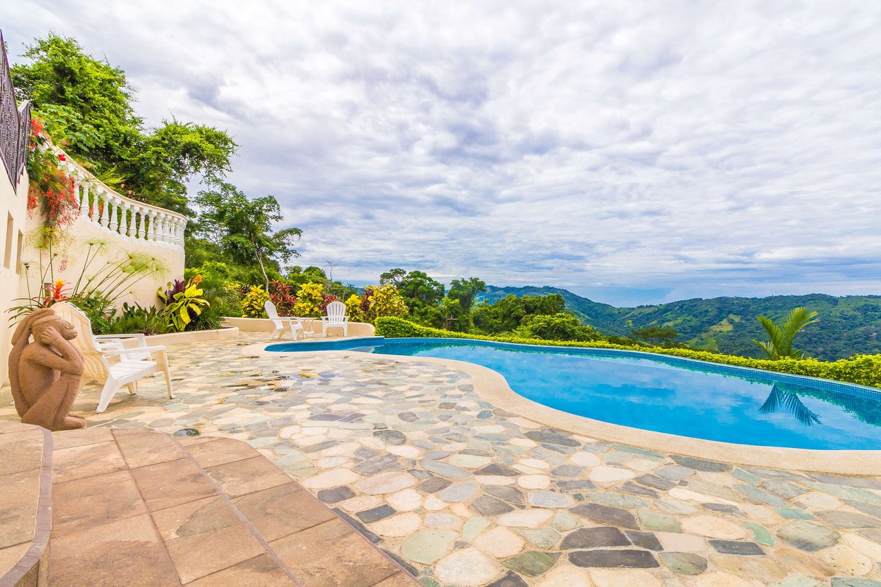 Beautiful 4500 sq ft home on 3.5 acres, gated community, expansive ocean, valley, and jungle views!