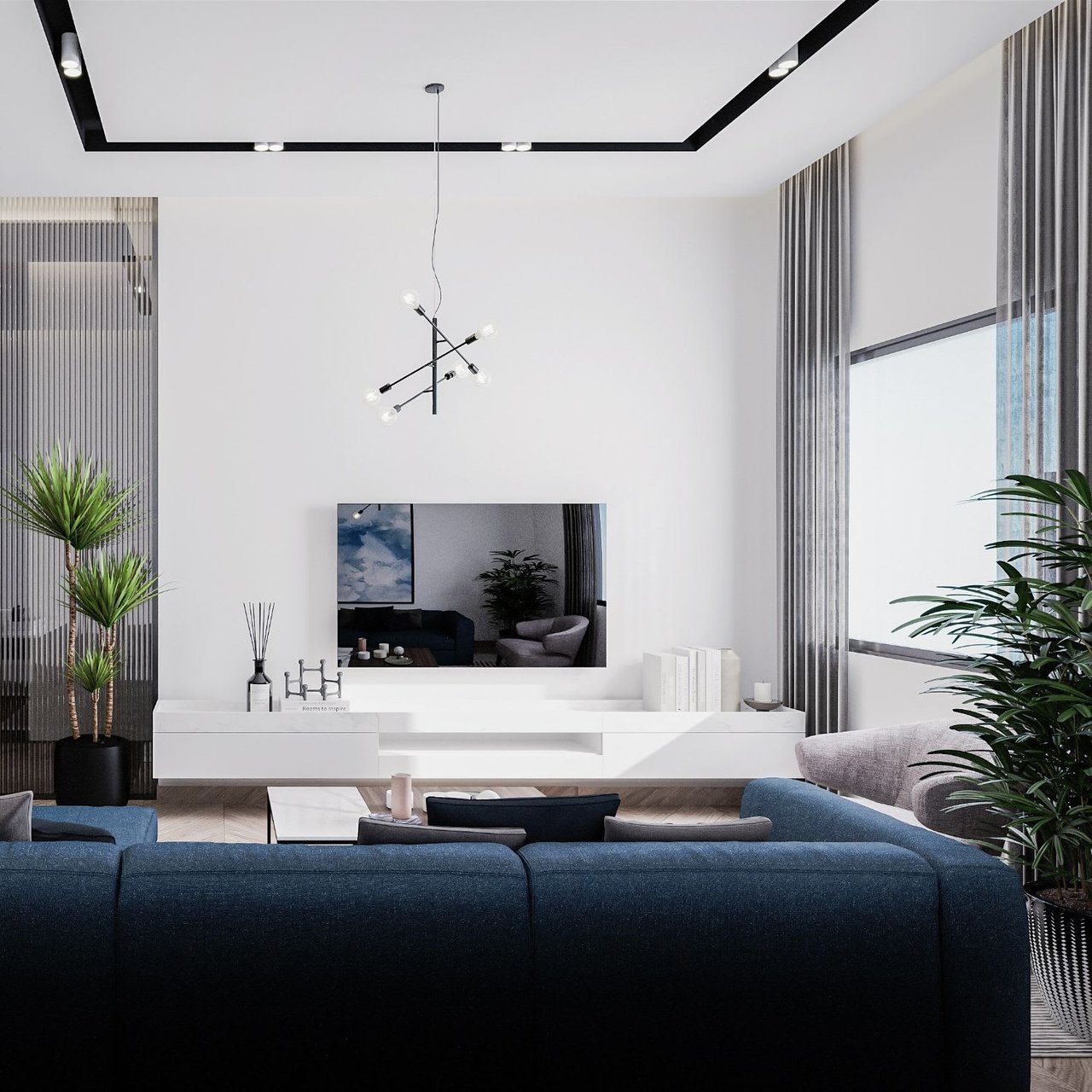  A spacious and modern living room featuring a large dark blue sectional sofa in the foreground.