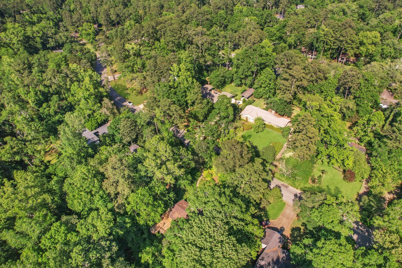 An aerial view of linene woods showing a densely wooded suburban area.