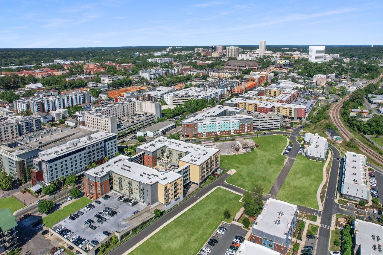 Another aerial view of College Town, highlighting the layout of buildings and streets, with a focus on the urban setting.