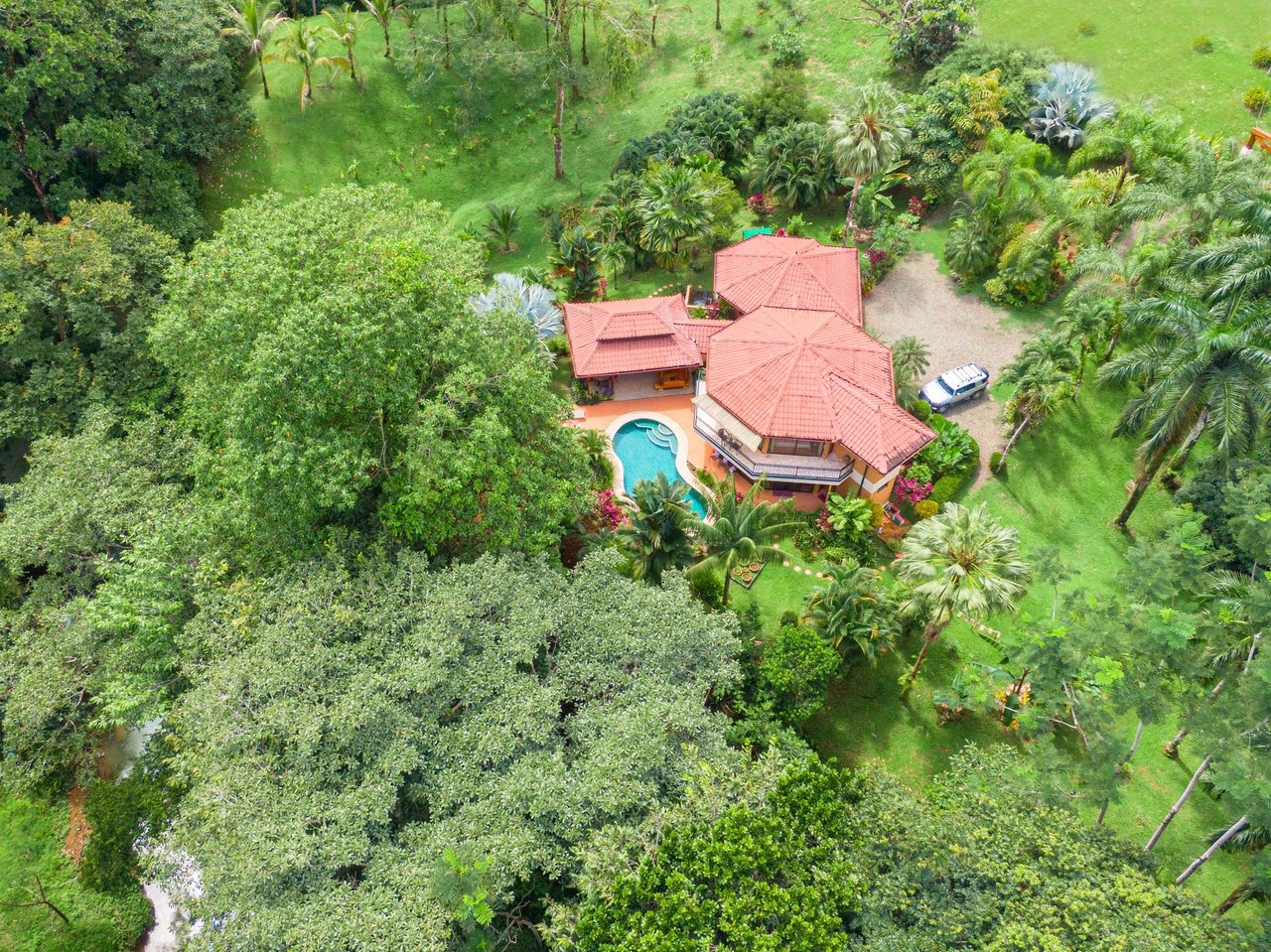 Stunning Tropical Home in Gated community with Hundreds of fruit trees  