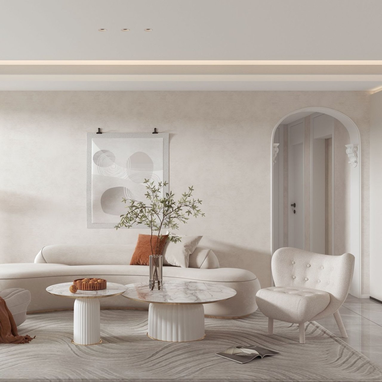  A minimalist living room features a curved off-white sofa with a rust-colored throw pillow.