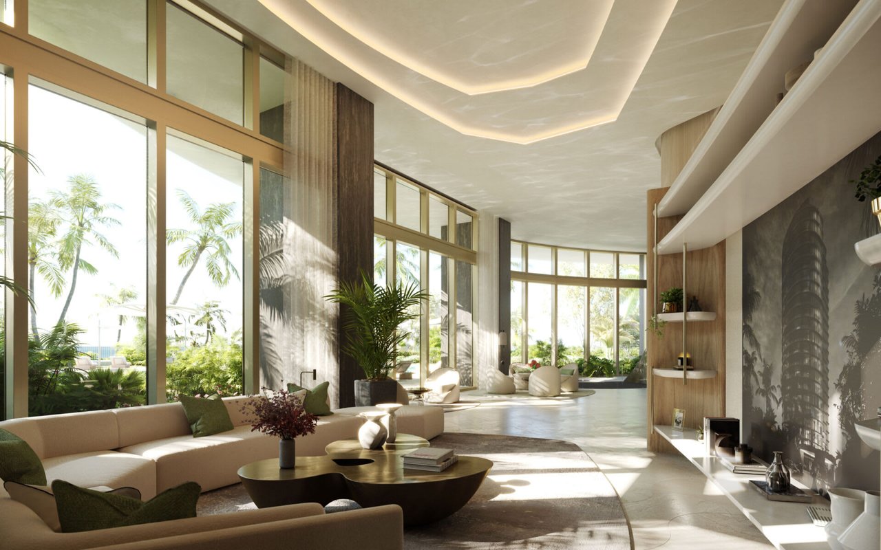 Residential lobby lounge with floor-to-ceiling windows, cream sofas, and views of palm trees.