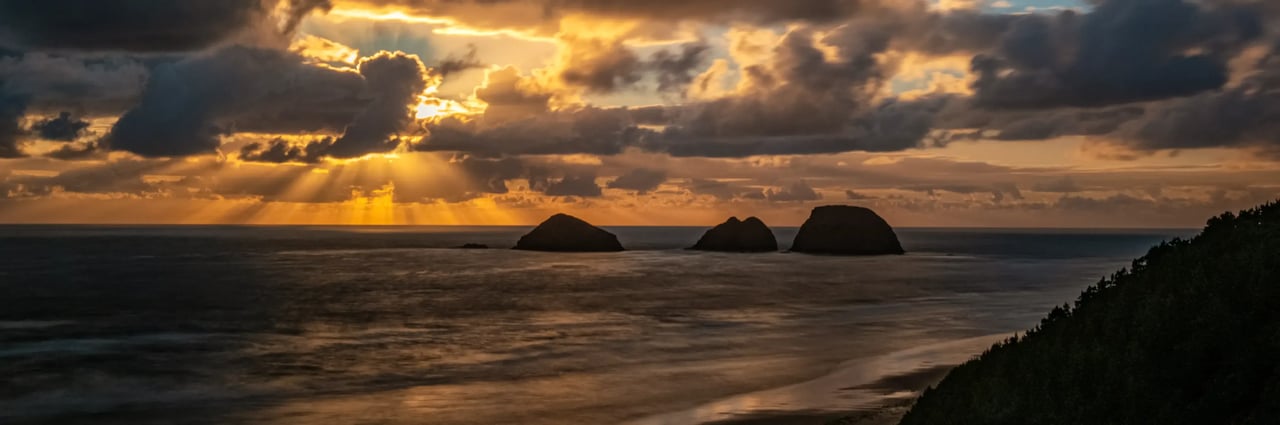 Cloudy spring view of the haystacks off Oceanside Oregon near sunset