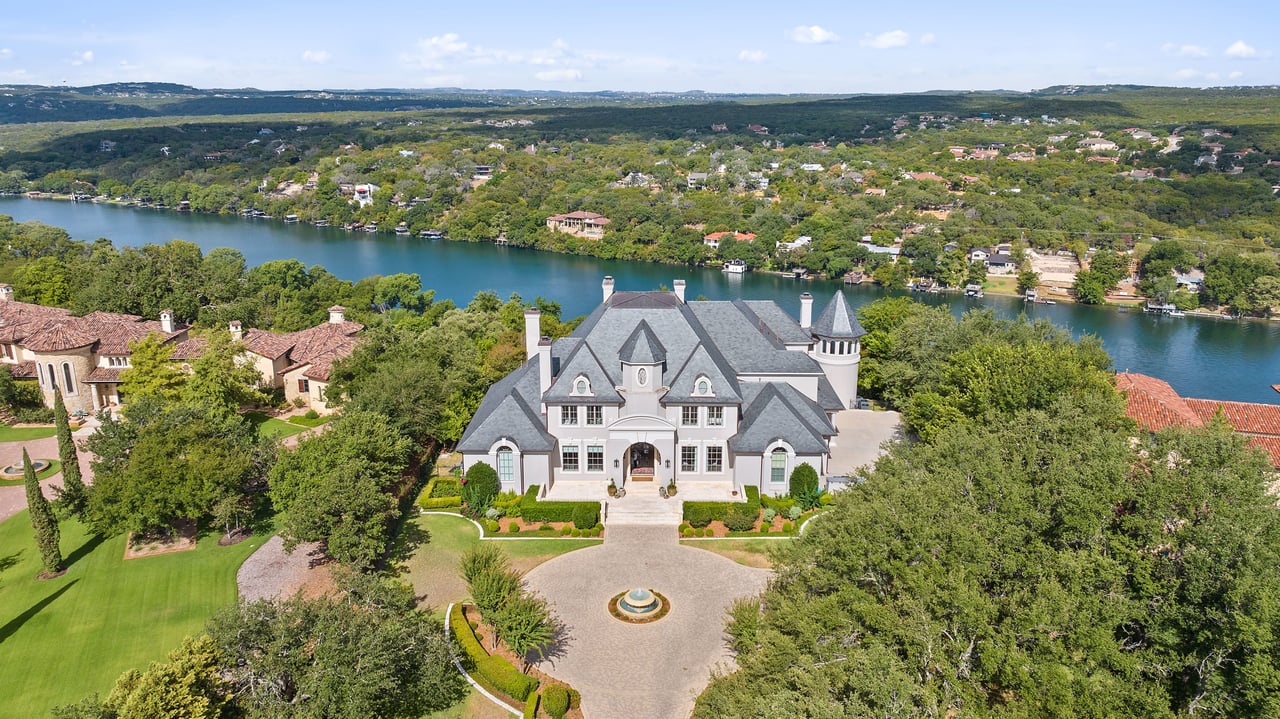 Introducing "The Legacy at Hunterwood Point!" Majestically overlooking Lake Austin, this residence offers panoramic vistas of the revered hill country.  The grandeur of this home, perhaps, rivals only the tranquil allure of the pristine lake it overlooks. Nestled within the secure gates of Hunterwood Point, this estate beckons you to bask in nature's sublime elegance and luxuriate in its magnificent opulence.