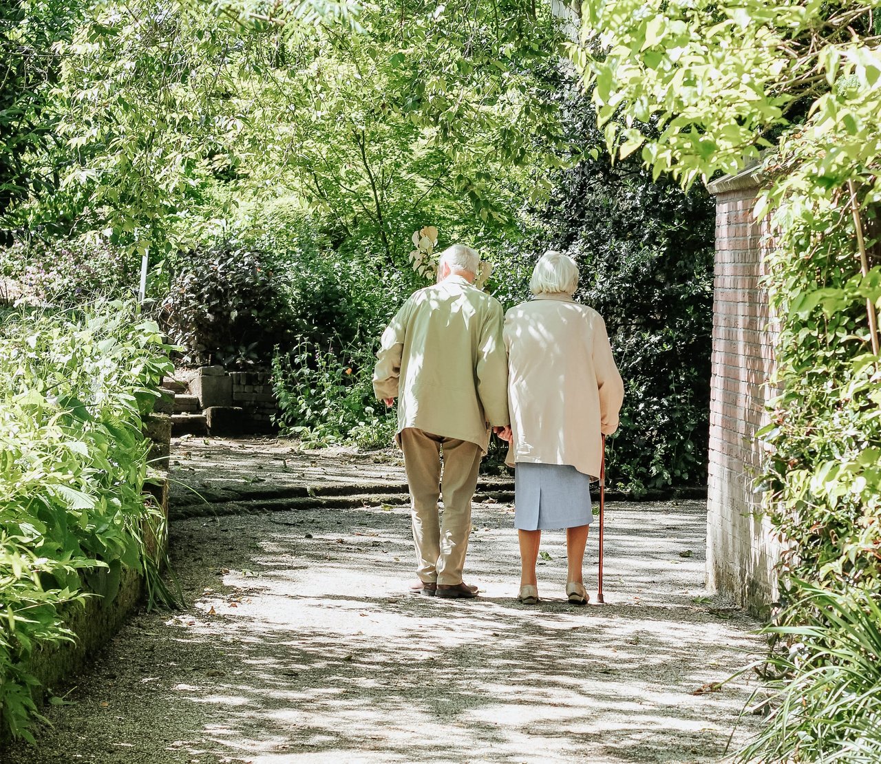 Elderly Couple Walking in Park