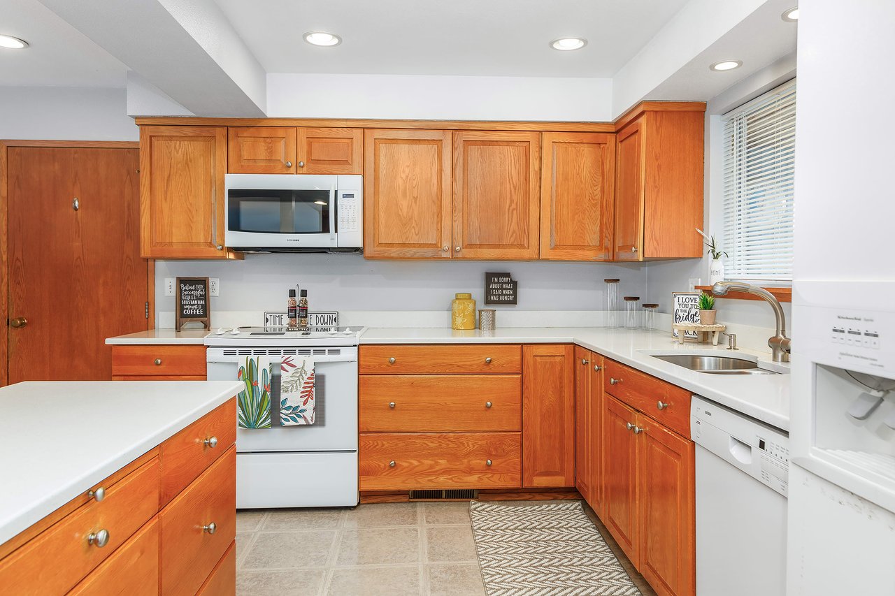 Enjoy the convenience of plenty of counter space in this well-appointed kitchen, providing ample room for meal preparation and culinary creativity.