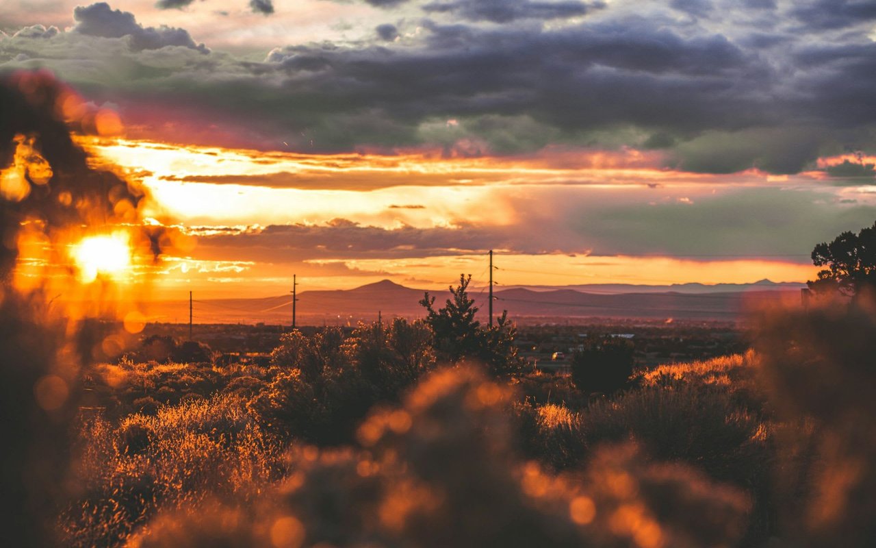 A beautiful sunset over a vast field.