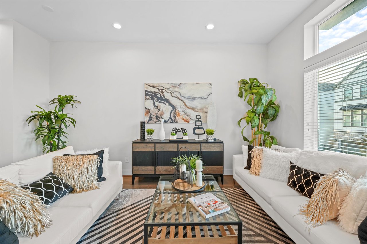 furnished living room in a model home at Donovan Heights