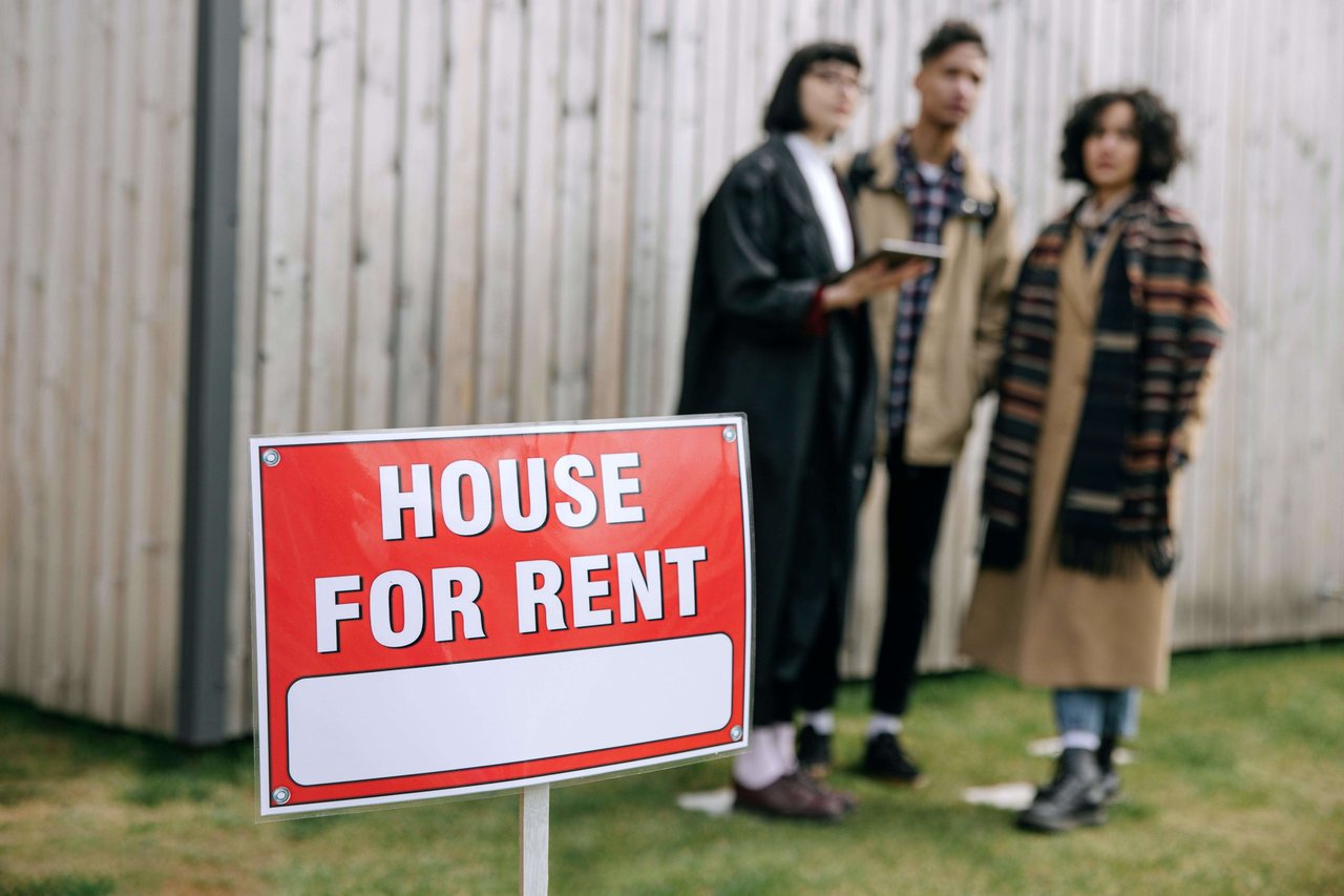 Landlady with tenants in house for rent