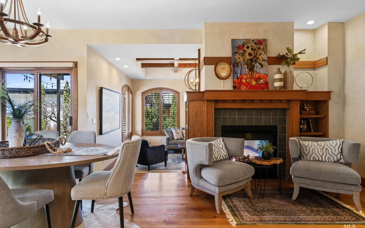 Sitting room flows into the dining room, which steps down into the living room. All bathed in natural light.