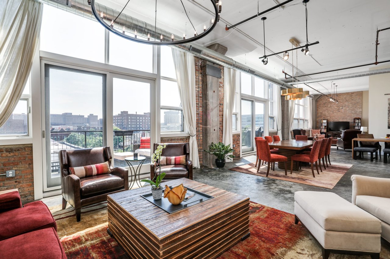 $1M Detroit condo has 55-foot wall of windows, glass doors, balconies