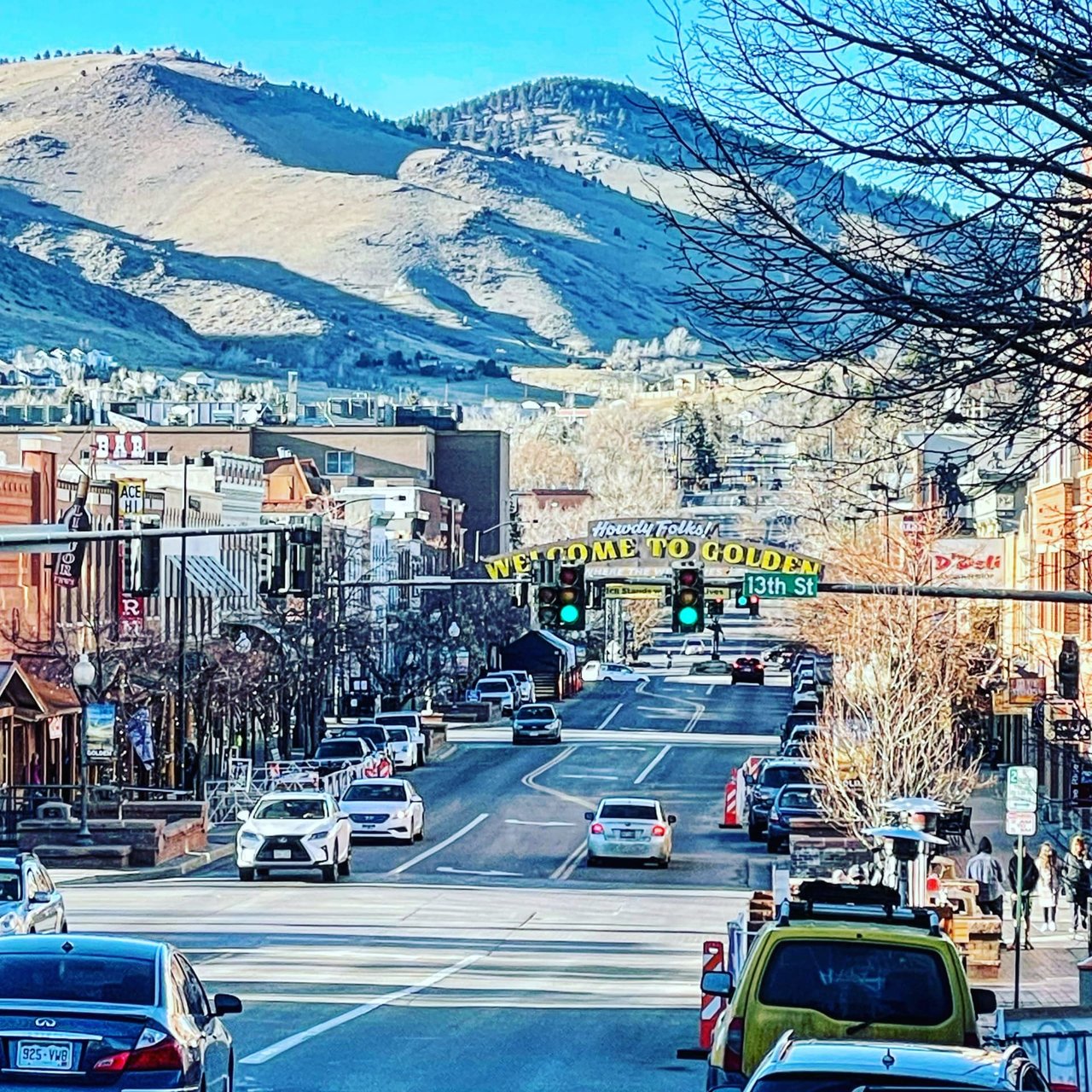 the main strip in Downtown Golden, CO, at the intersection with 13th street, with the sign that says "Howdy Folks! Welcome to Golden. Where the West Lives"